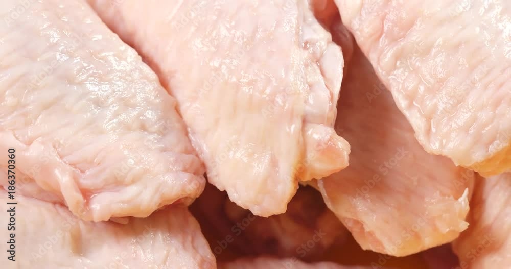 Raw chicken wing in slider motion Raw chicken wing in slider motion