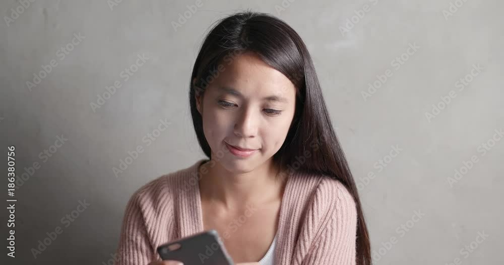 Woman focus on looking at smart phone Woman focus on looking at smart phone