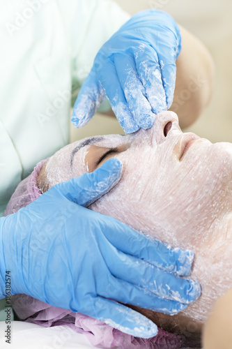 Process cosmetic mask of massage and facials in beauty salon