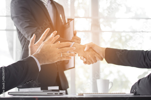 Business people shaking hand to cooperate and deal in business successful. photo