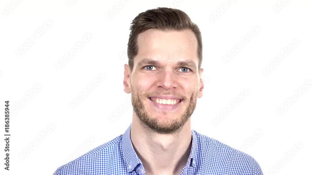 Smiling beautiful guy looking at camera isolated on white background. Portrait of satisfied young man. Happy successful businessman Smiling beautiful guy looking at camera isolated on white background. Portrait of satisfied young man. Happy successful businessman