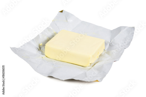 Piece of fresh butter on white background