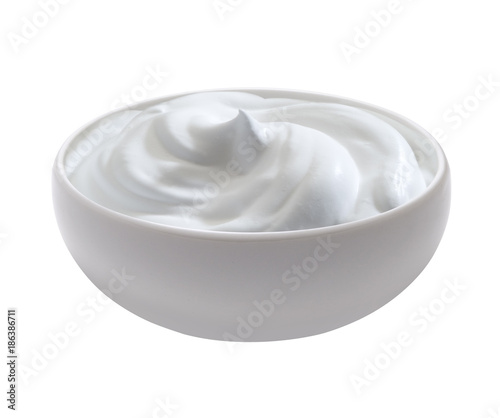 white cup filled of milk cream, isolated oh white without shadow
