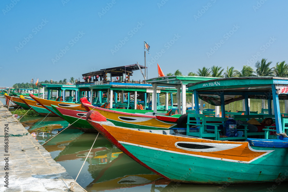 Tourist boats in harbor in the city of Hoi An, Vietbam