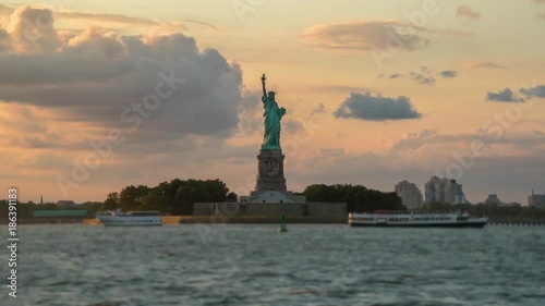 Statue of Liberty hyperlapse during sunset. NYC. photo