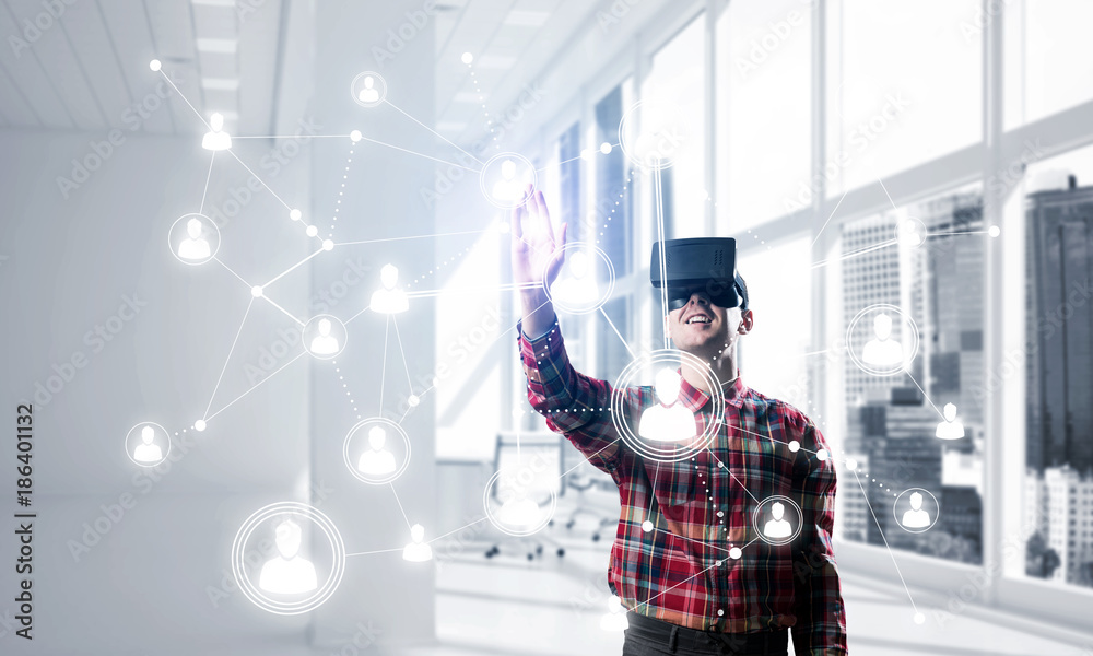 Guy wearing checked shirt and virtual mask reaching hand to touch screen Guy wearing checked shirt and virtual mask reaching hand to touch screen