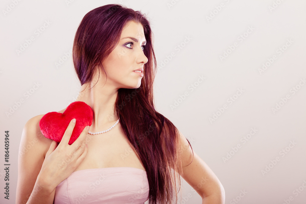 Beautiful woman holds red heart Beautiful woman holds red heart