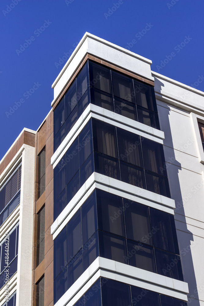 Corner shot of closed balcony from modern facade building Corner shot of closed balcony from modern facade building
