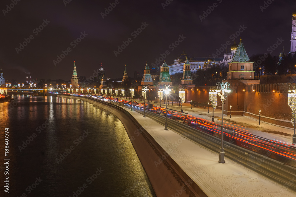 Christmas decoration of  Moscow, Russia, embankment with car light trail, and  the  Kremlin.