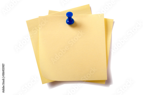 Untidy pinned stack pile square yellow sticky post it note with pushpin isolated on white background photo
