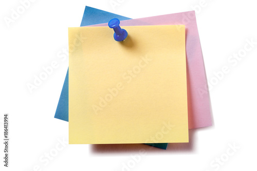 Untidy stack pile group various different colors square sticky post it note yellow on top pinned with pushpin isolated on white background photo