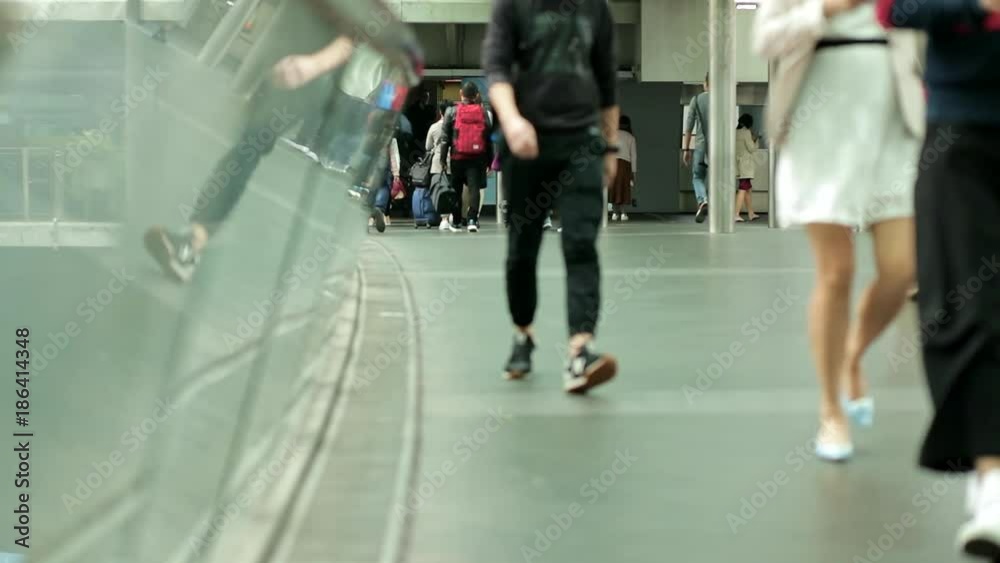 Slow motion of people walking in the pedestrian bridge Slow motion of people walking in the pedestrian bridge