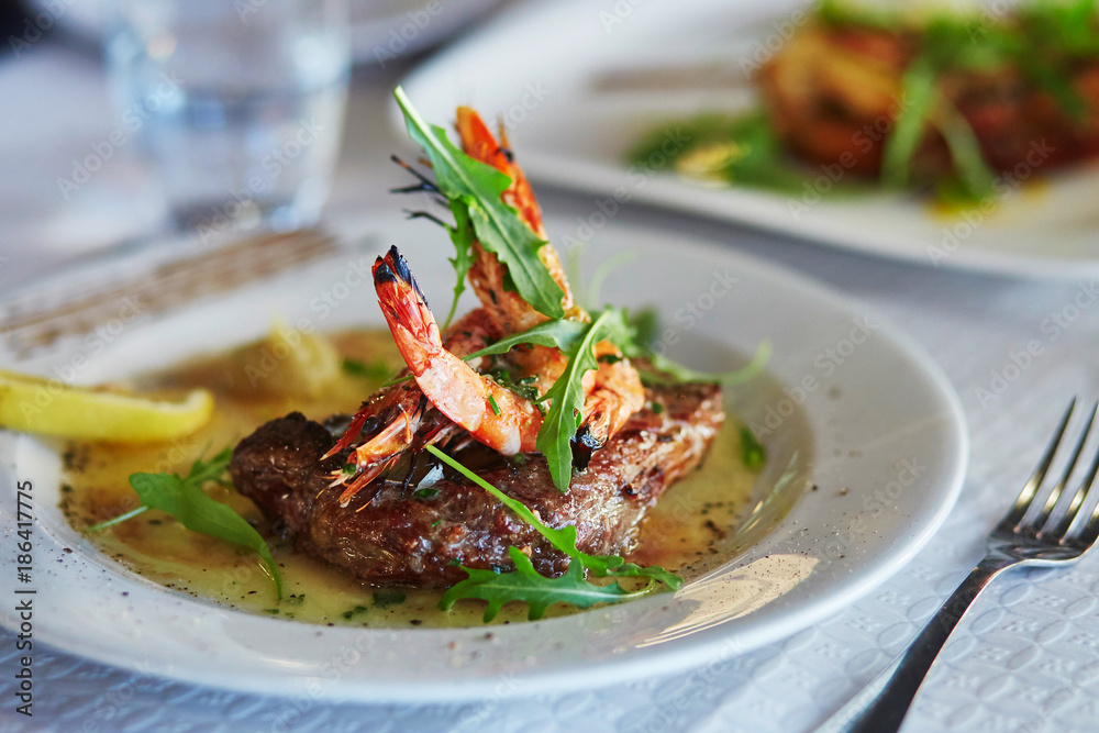 Grilled meat with shrimps and lemon sauce Grilled meat with shrimps and lemon sauce