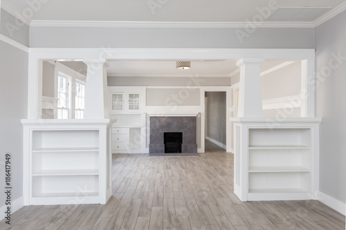 Принти на полотні Living Room interior after remodelling with fire place and grey wooden floor for virtual staging