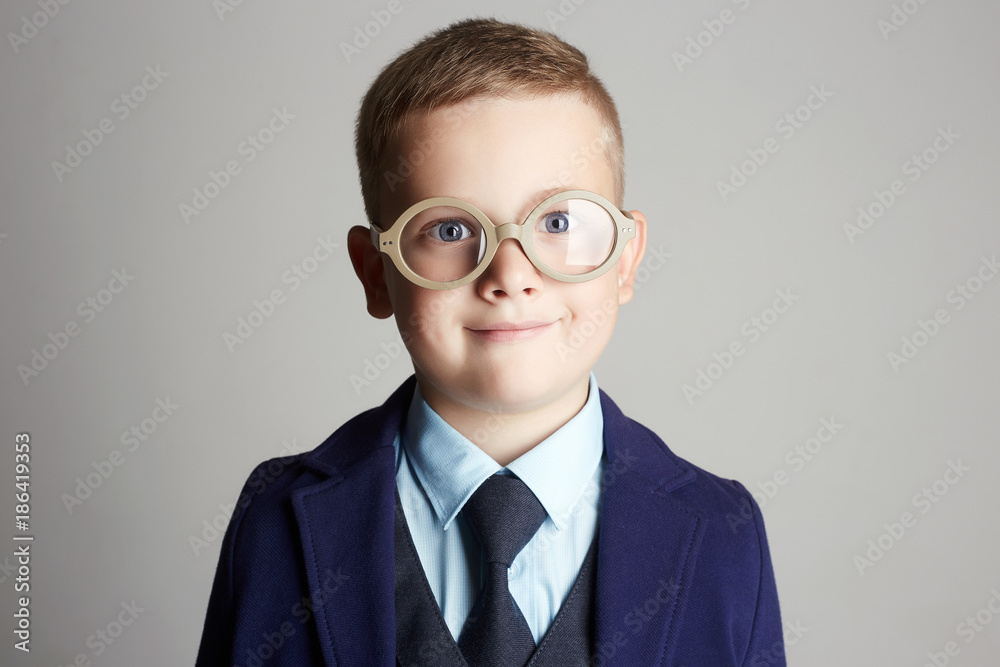 funny child in glasses. little boy in suit