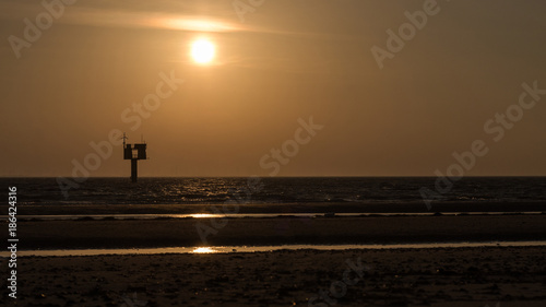 In the evening sun on a deserted beach