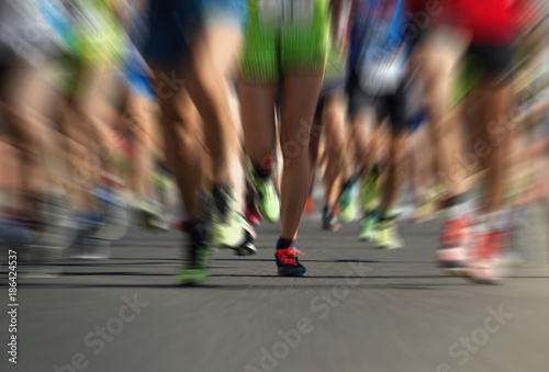 Abstract marathon running race, people feet on city road