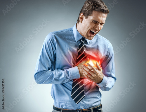 Photography Office manager holding hands on painful chest