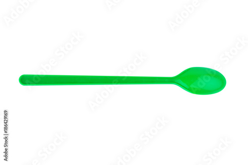 green spoon plastic isolated on white background