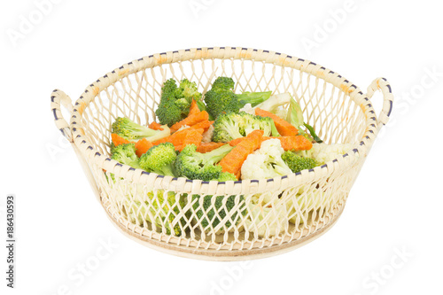 cauliflower. carrot. broccoli. slice. in basket wooden. isolated on white background