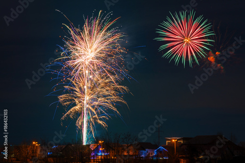 Fireworks show above the houses © bogdanvija