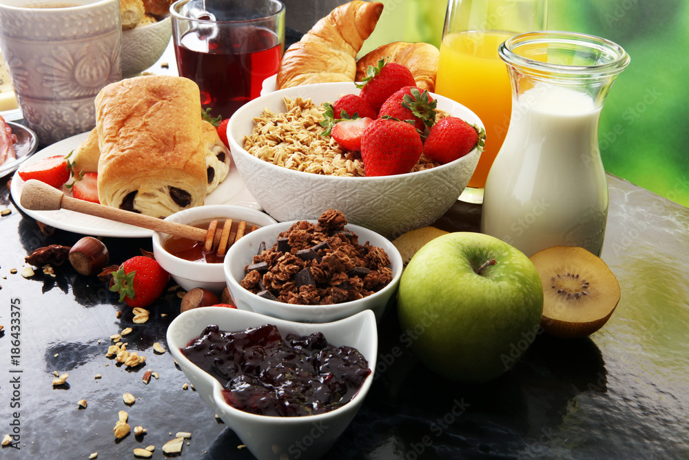 Breakfast served with coffee, orange juice, croissants and strawberry, jam and tea. Breakfast served with coffee, orange juice, croissants and strawberry, jam and tea.
