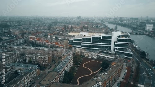 Aerial view of Amsterdam from the southern part towards city center involving the Amstel river, residential and business buildings photo