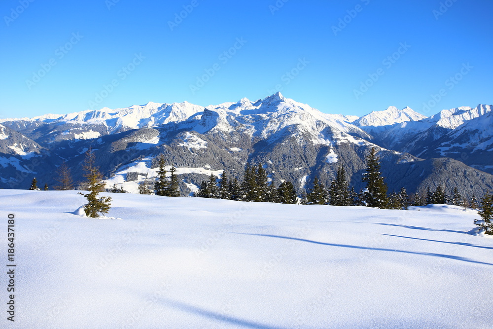 Fototapeta premium Wintery mountain landscape with sunshine