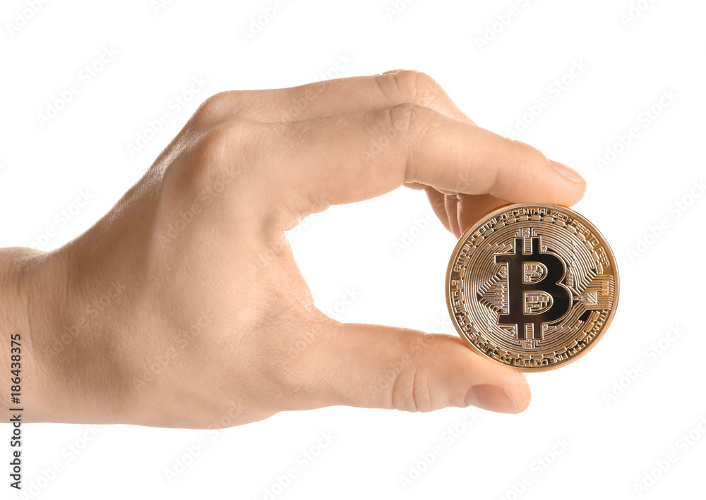 Hand holding golden bitcoin on white background Hand holding golden bitcoin on white background