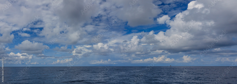 Panorama Blue sea and blue sky with white cloud Panorama Blue sea and blue sky with white cloud in oil and gas platform background.. Panorama Blue sea and blue sky with white cloud Panorama Blue sea and blue sky with white cloud in oil and gas platform background..