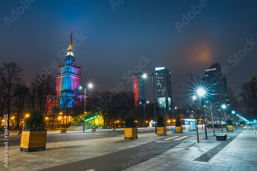Night view of Palace of Culture and Science and downtown with business skyscrapers