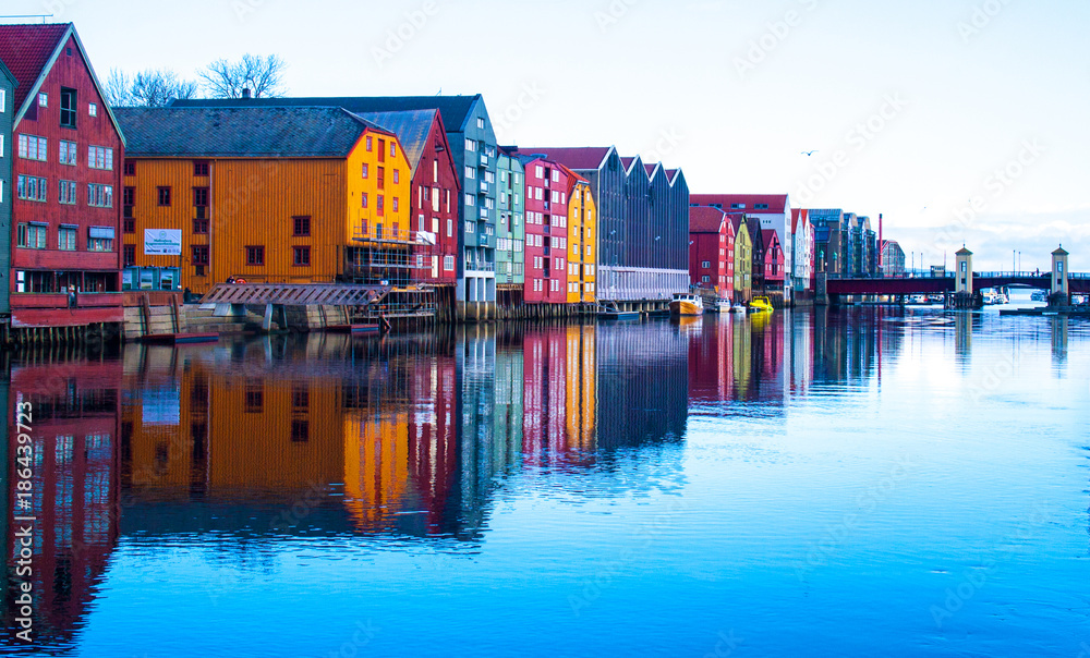 Bright buildings and beautiful reflections on the waterfront at Trondheim, Norway