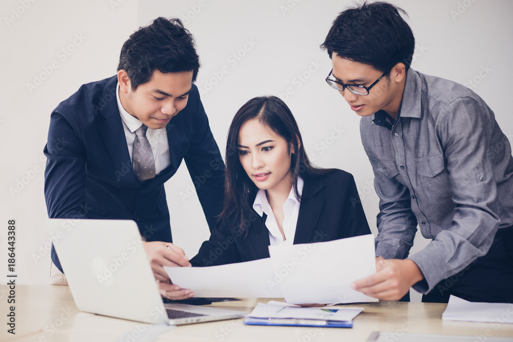 Asian businessmen and group using notebook for business partners discussing documents and ideas at meeting and business women smiling happy for working Asian businessmen and group using notebook for business partners discussing documents and ideas at meeting and business women smiling happy for working