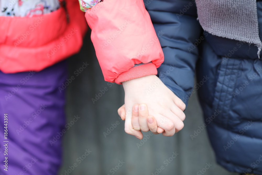 children hand in hand