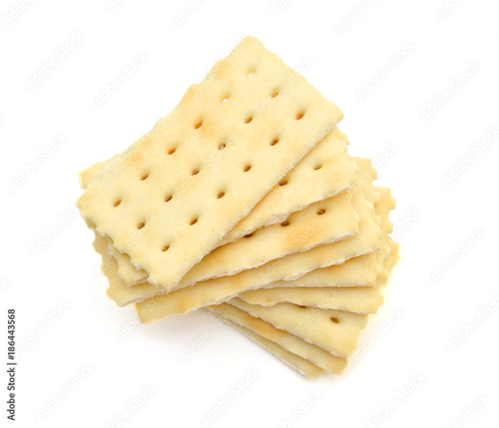 Stack of saltine crackers isolated on white. Stack of saltine crackers isolated on white.