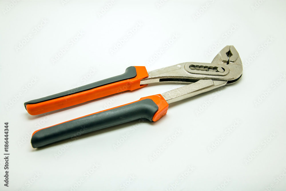 Adjustable plumbing and pipe wrench pincers. Isolated photo Adjustable plumbing and pipe wrench pincers. Isolated photo