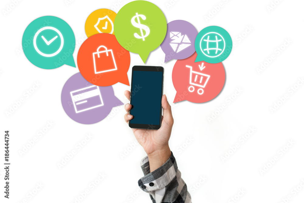 E-Commerce Hand holding smart phone with floating online shopping icon in balloon, isolated white background E-Commerce Hand holding smart phone with floating online shopping icon in balloon, isolated white background