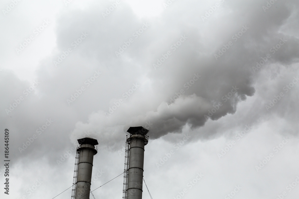 The smoke from the chimneys of the CHP. Pollution of the environment. Environmental disaster. The smoke from the chimneys of the CHP. Pollution of the environment. Environmental disaster.
