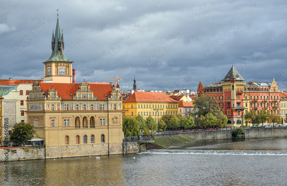 Prague, Czech Republic - October 10, 2017: View on ancient Old Town Water Tower and Vltava river, Prague, Czech Republic. Staromestska vodarna.