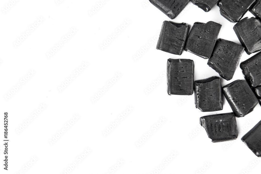 Aniseed flavor blackjack candy chews on white background with copy space Aniseed flavor blackjack candy chews on white background with copy space