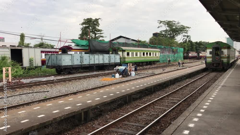 Train arriving at Thonburi train station in Bangkok Thailand Train arriving at Thonburi train station in Bangkok Thailand