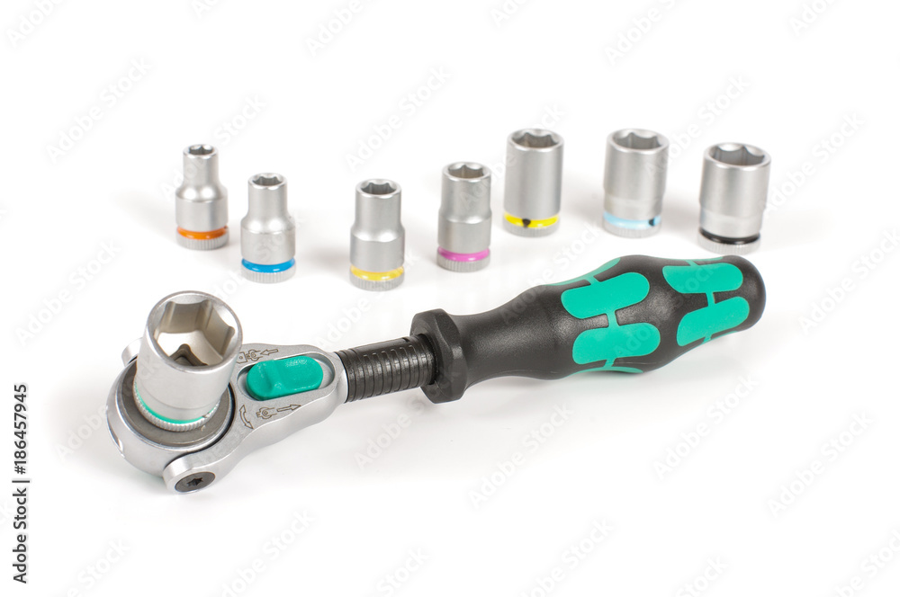 Socket wrench with various bits on the white background Socket wrench with various bits on the white background