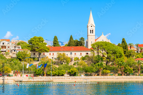 Old church in Sumartin port on sunny summer day, Brac island, Croatia