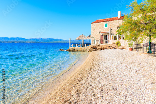 Beautiful beach and small coastal restaurant in Bol town, Brac island, Croatia