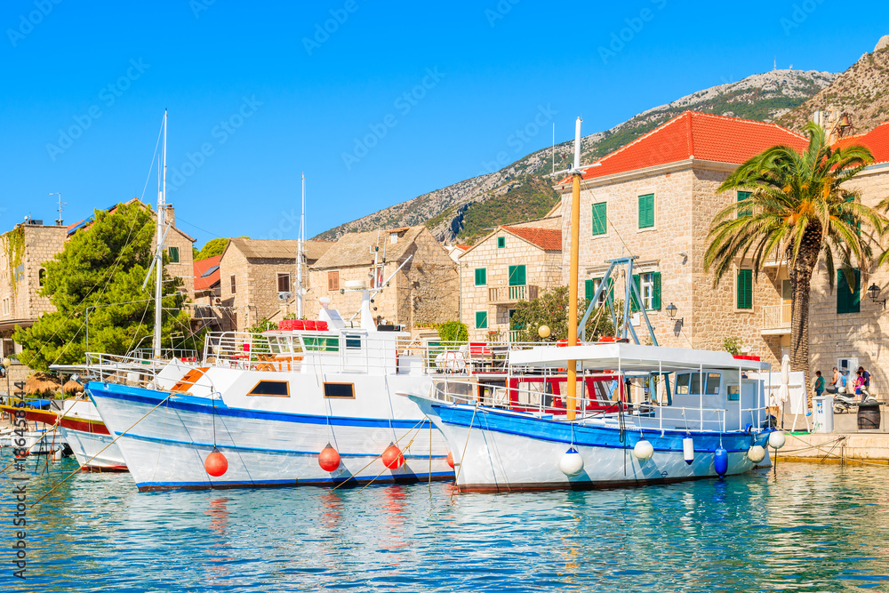 View of Bol port with fishing boats on sunny summer day, Brac island, Croatia