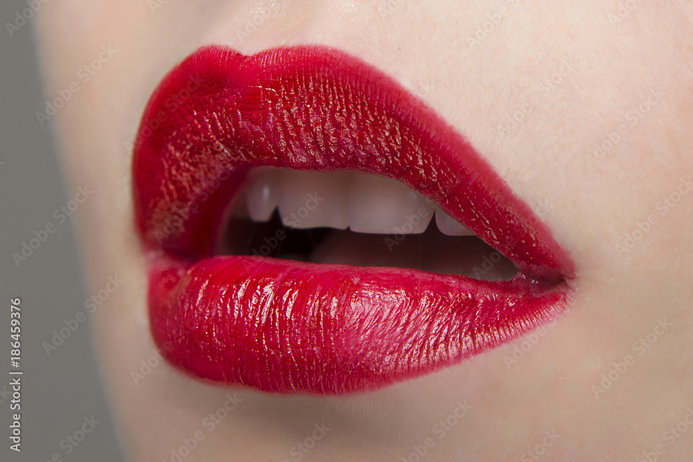 Red lipstick on the lips ajar Red lipstick on the lips ajar