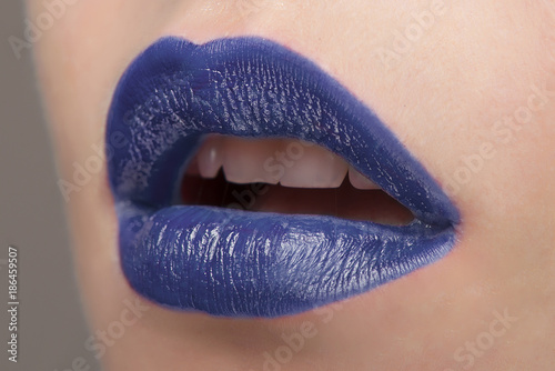 Lips with blue lipstick close-up photo