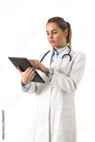 Young female doctor using digital tablet