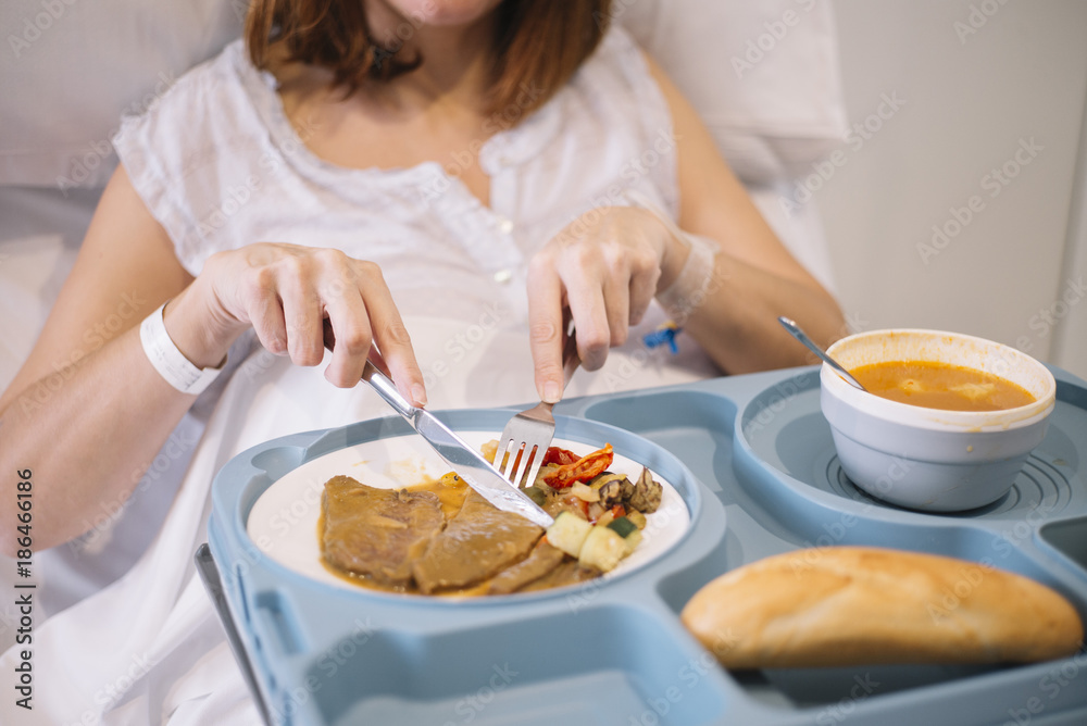 woman eating in the hospital