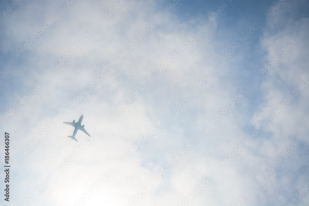 Airplane Silhouette through the Clouds Airplane Silhouette through the Clouds